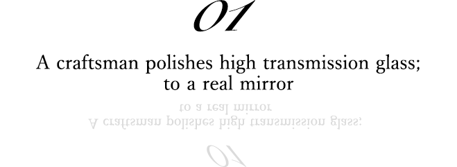 01 A craftsman polishes high transmission glass; to a real mirror
